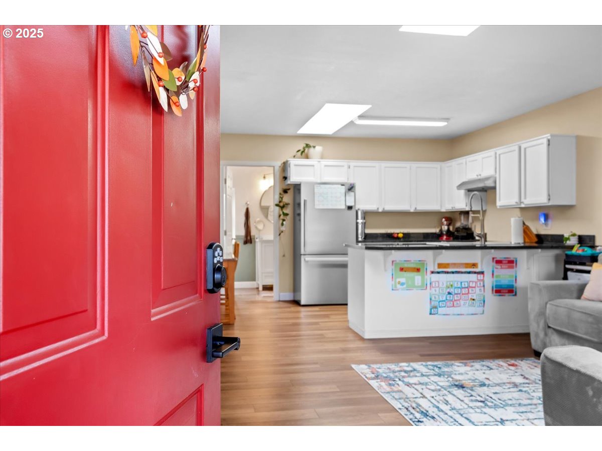1720 B Street Forest Grove, OR 97116 - Photo 9 of 38 a kitchen with refrigerator and microwave