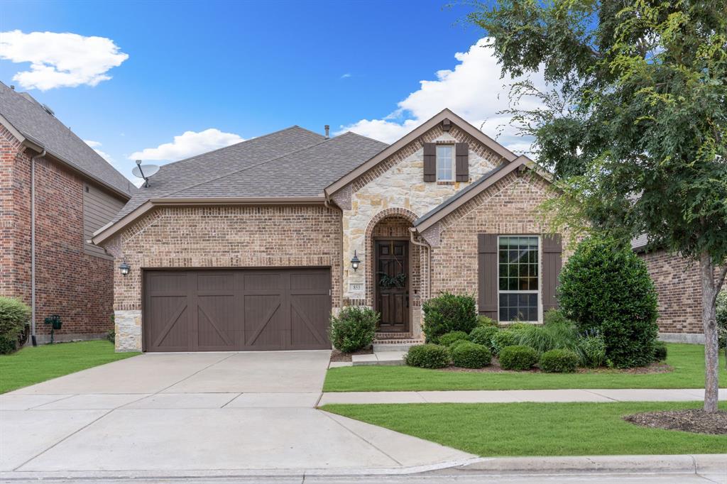 853 Field Crossing Little Elm, TX 76227 - Photo 1 of 24 a front view of a house with a yard and garage