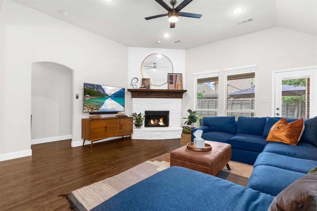 853 Field Crossing Little Elm, TX 76227 - Photo 11 of 24 a living room with furniture and a fireplace