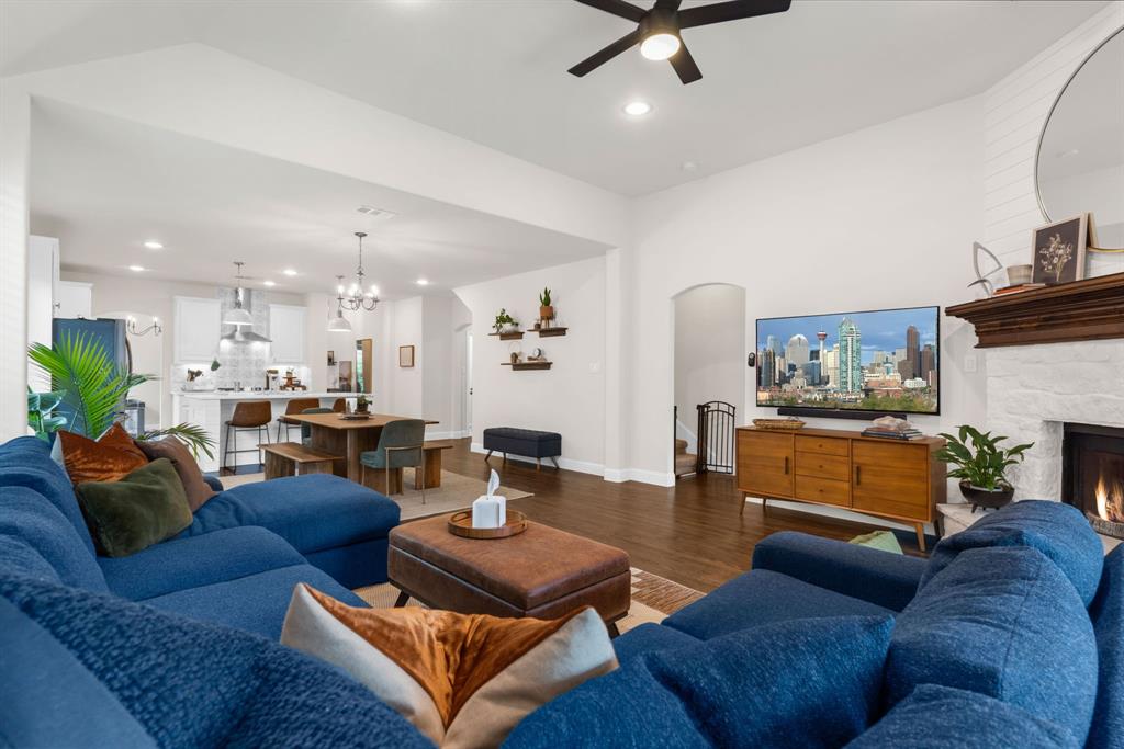 853 Field Crossing Little Elm, TX 76227 - Photo 13 of 24 a living room with furniture and a fireplace