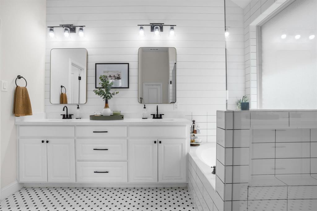 853 Field Crossing Little Elm, TX 76227 - Photo 15 of 24 a bathroom with a double vanity sink a mirror and a shower