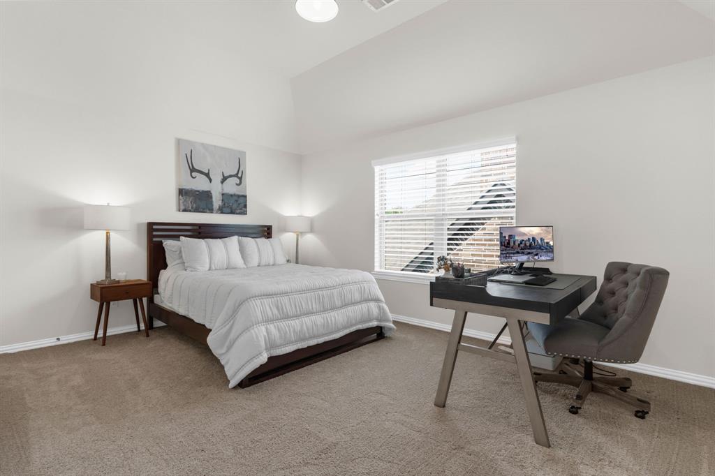 853 Field Crossing Little Elm, TX 76227 - Photo 17 of 24 a bedroom with a bed a desk and chair