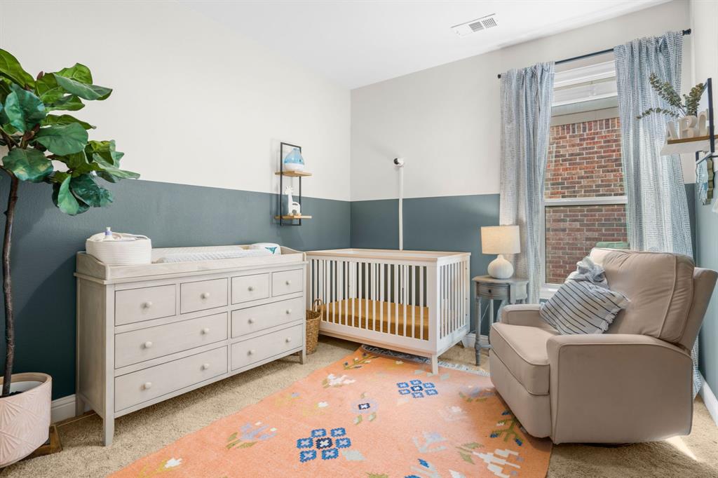 853 Field Crossing Little Elm, TX 76227 - Photo 18 of 24 a bedroom with windows and a potted plant