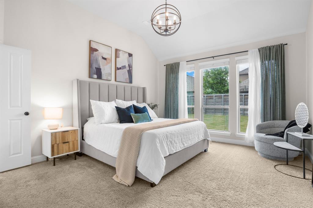 853 Field Crossing Little Elm, TX 76227 - Photo 4 of 24 a spacious bedroom with a bed and a large window