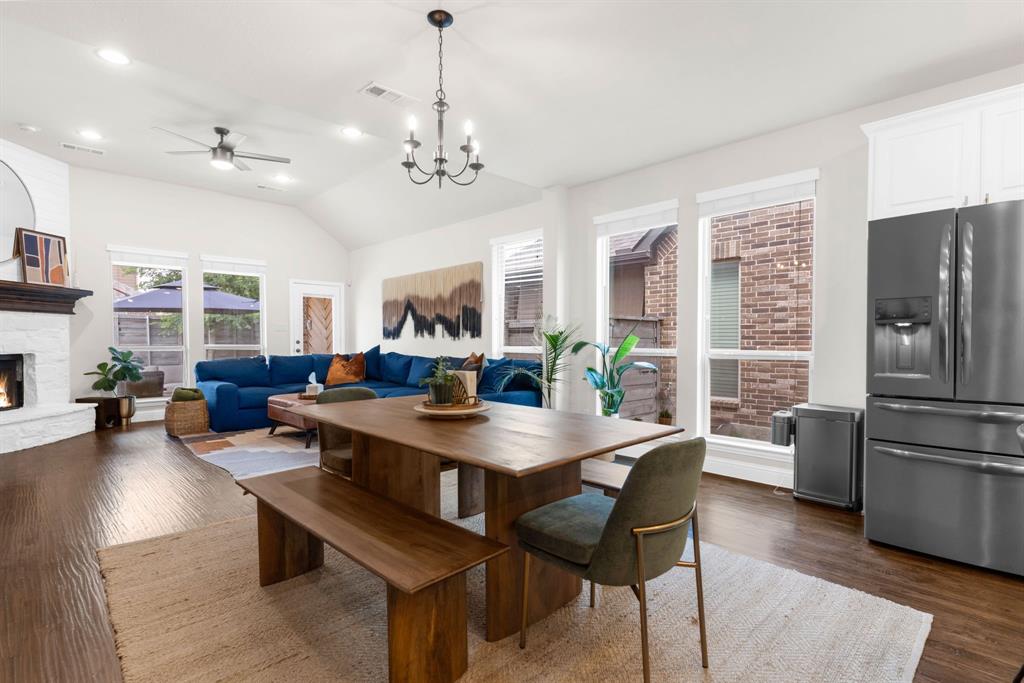 853 Field Crossing Little Elm, TX 76227 - Photo 9 of 24 a view of a dining room with furniture window and wooden floor