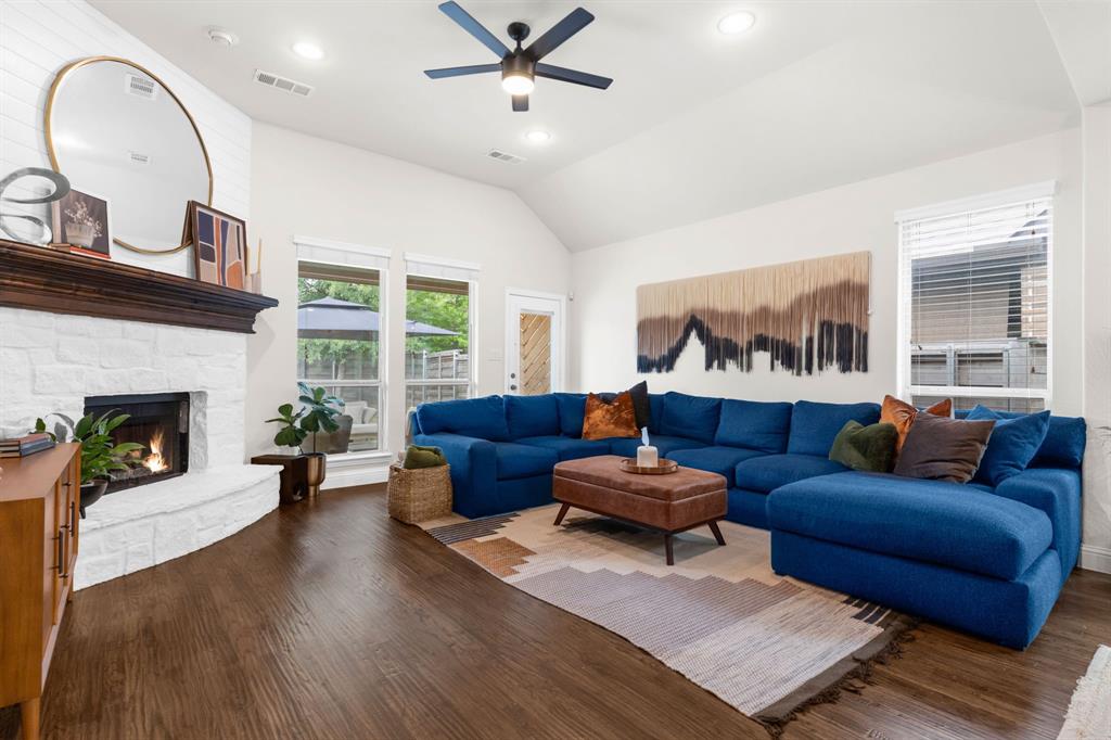 853 Field Crossing Little Elm, TX 76227 - Photo 10 of 24 a living room with furniture and a fireplace