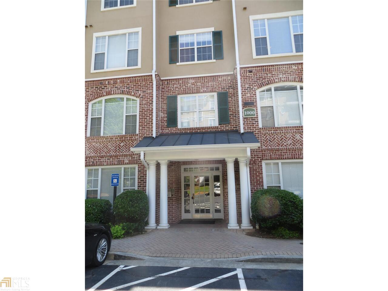 1101 Stratford Commons, Unit 110 Decatur, GA 30033 - Photo 1 of 1 a view of a brick building with many windows