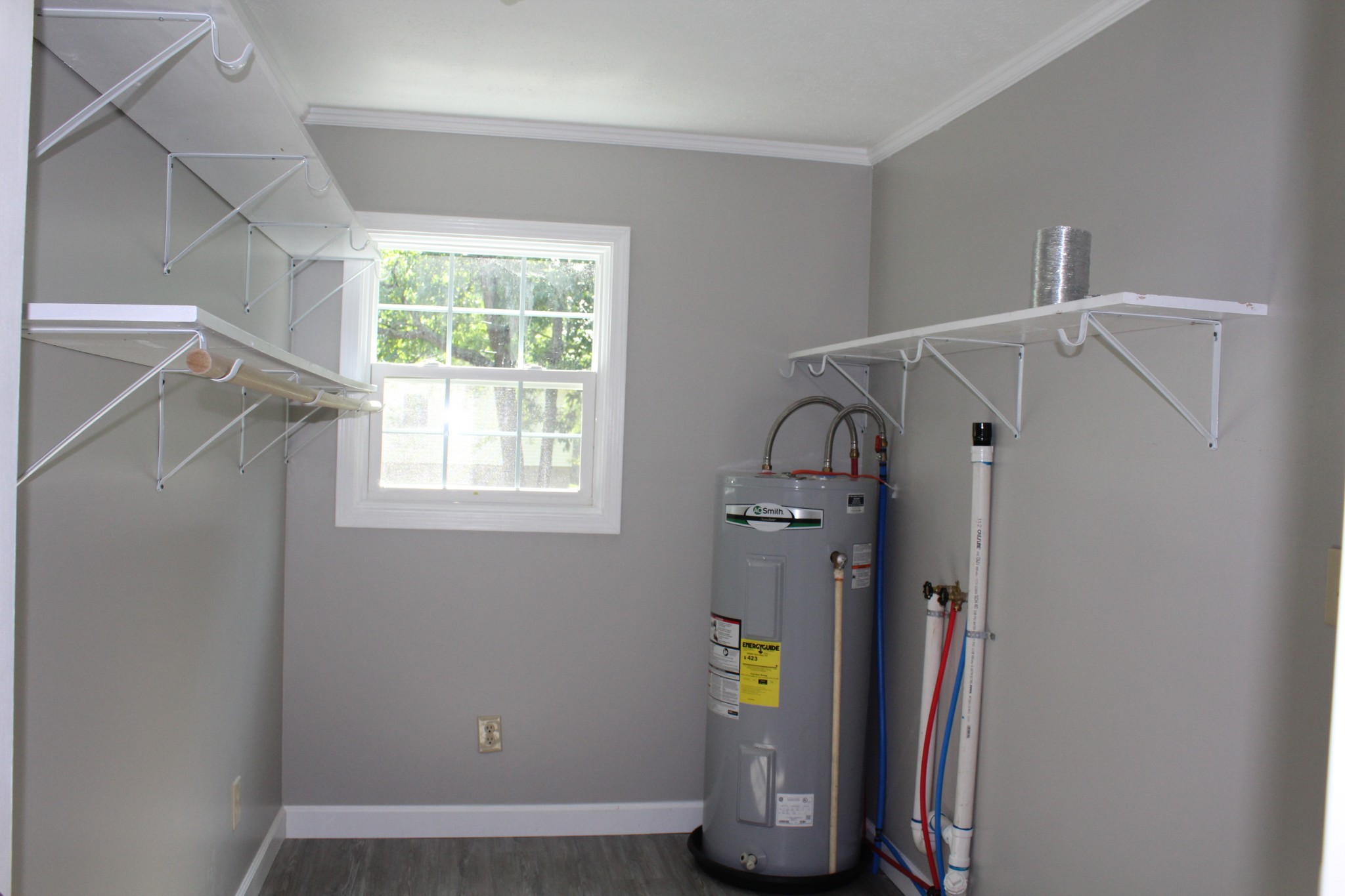 1275 Herman Adams Road Cumberland City, TN 37050 - Photo 12 of 25 a view of water heater room with windows
