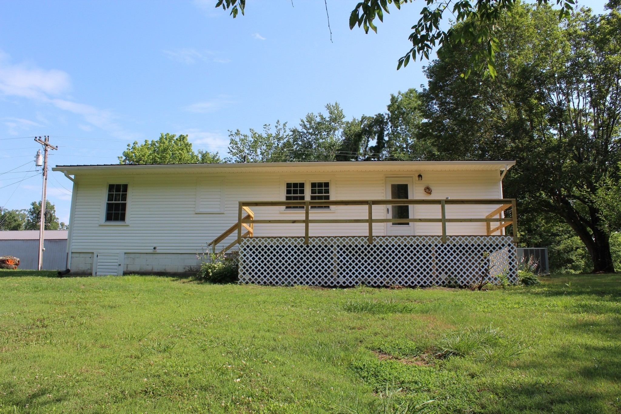 1275 Herman Adams Road Cumberland City, TN 37050 - Photo 19 of 25 a view of a back yard