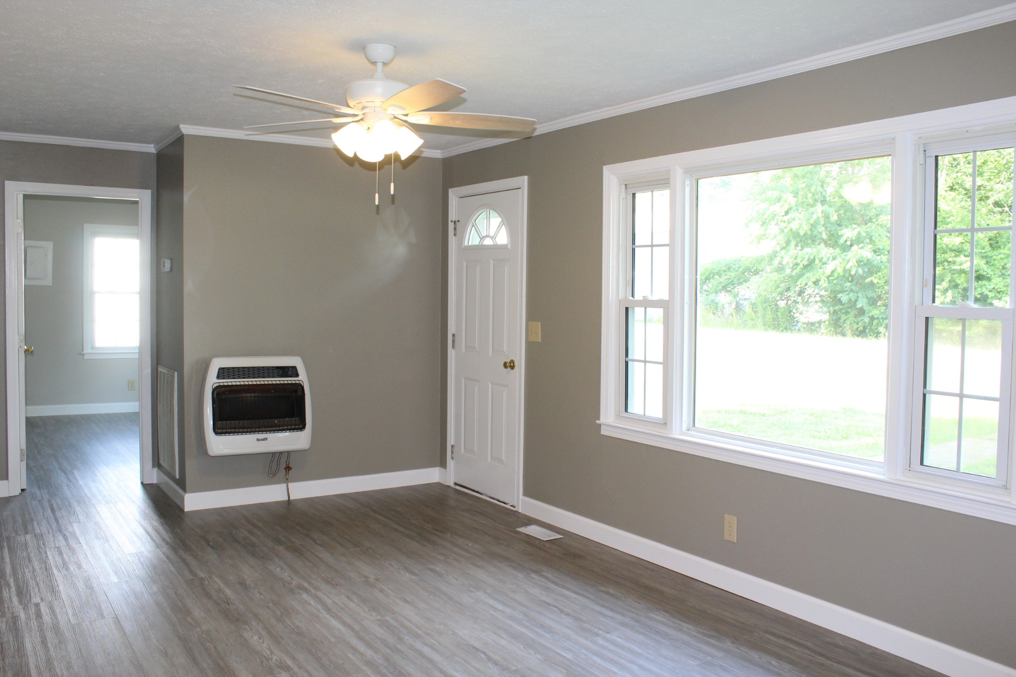 1275 Herman Adams Road Cumberland City, TN 37050 - Photo 7 of 25 a view of a livingroom with a ceiling fan and window