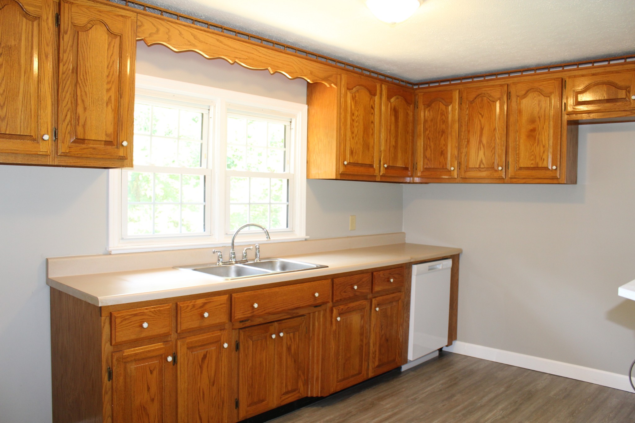 1275 Herman Adams Road Cumberland City, TN 37050 - Photo 10 of 25 a kitchen with a sink and a window
