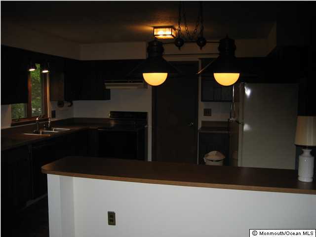 397 Leesville Road Jackson, NJ 08527 - Photo 15 of 18 a kitchen that has a sink and a stove