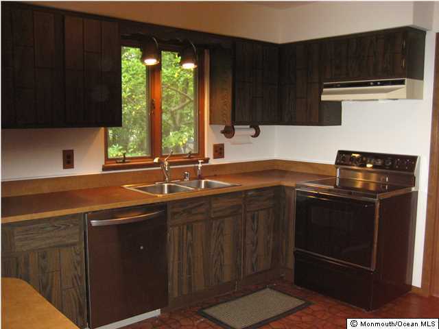 397 Leesville Road Jackson, NJ 08527 - Photo 17 of 18 a kitchen with a sink and a stove