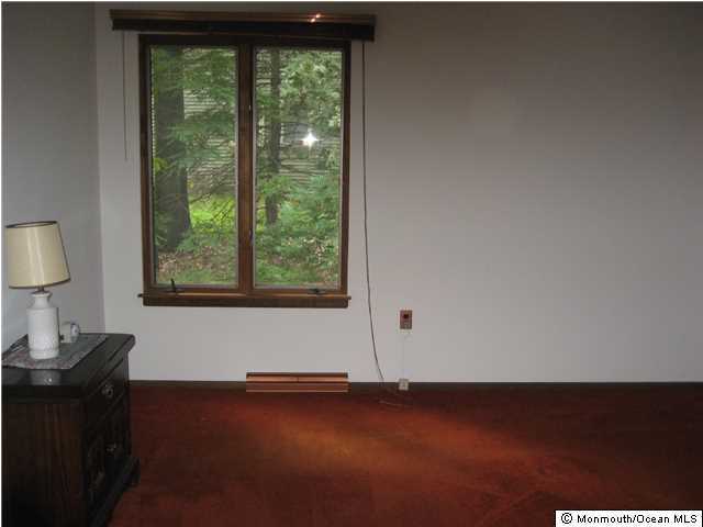 397 Leesville Road Jackson, NJ 08527 - Photo 18 of 18 a view of wooden floor and windows in a room