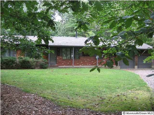 397 Leesville Road Jackson, NJ 08527 - Photo 3 of 18 a view of a backyard with table and chairs and a large tree