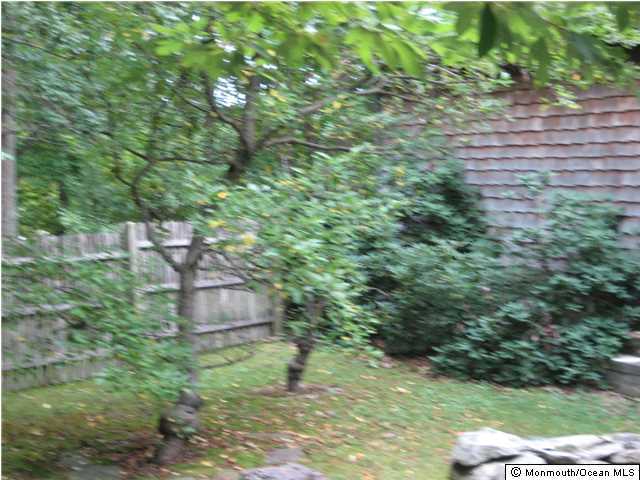 397 Leesville Road Jackson, NJ 08527 - Photo 6 of 18 a backyard of a house with lots of green space and fountain