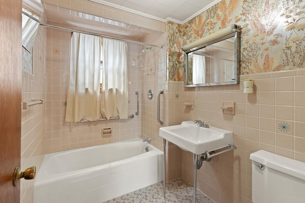 200 Broadway Somerville, MA 02145 - Photo 14 of 25 a bathroom with a sink a toilet and shower