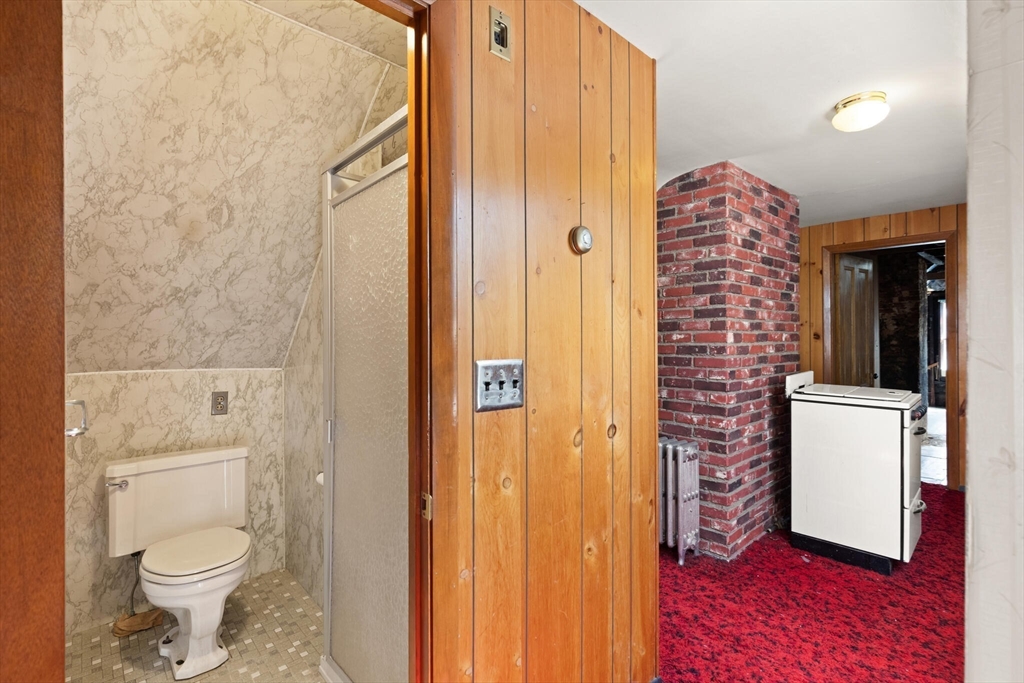 200 Broadway Somerville, MA 02145 - Photo 17 of 25 a bathroom with a toilet and a shower