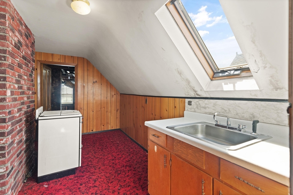 200 Broadway Somerville, MA 02145 - Photo 18 of 25 a bathroom with a sink and a mirror