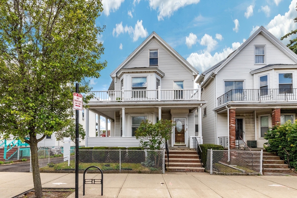 200 Broadway Somerville, MA 02145 - Photo 2 of 25 a front view of a house with a garden