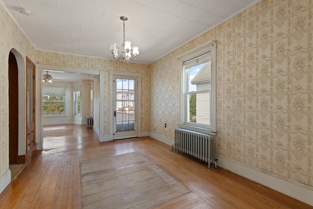 200 Broadway Somerville, MA 02145 - Photo 7 of 25 wooden floor in an empty room with a window