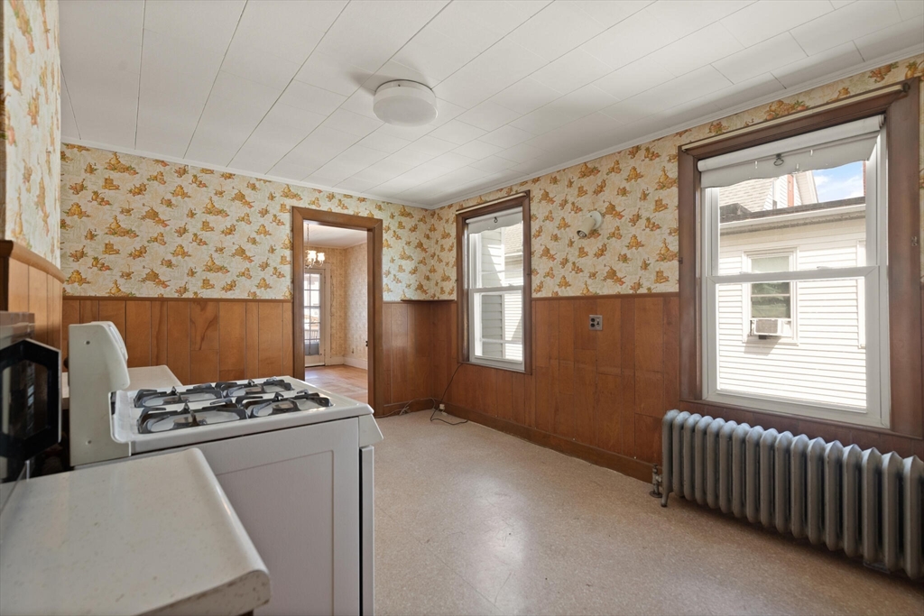 200 Broadway Somerville, MA 02145 - Photo 10 of 25 a kitchen that has a lot of furniture and a window