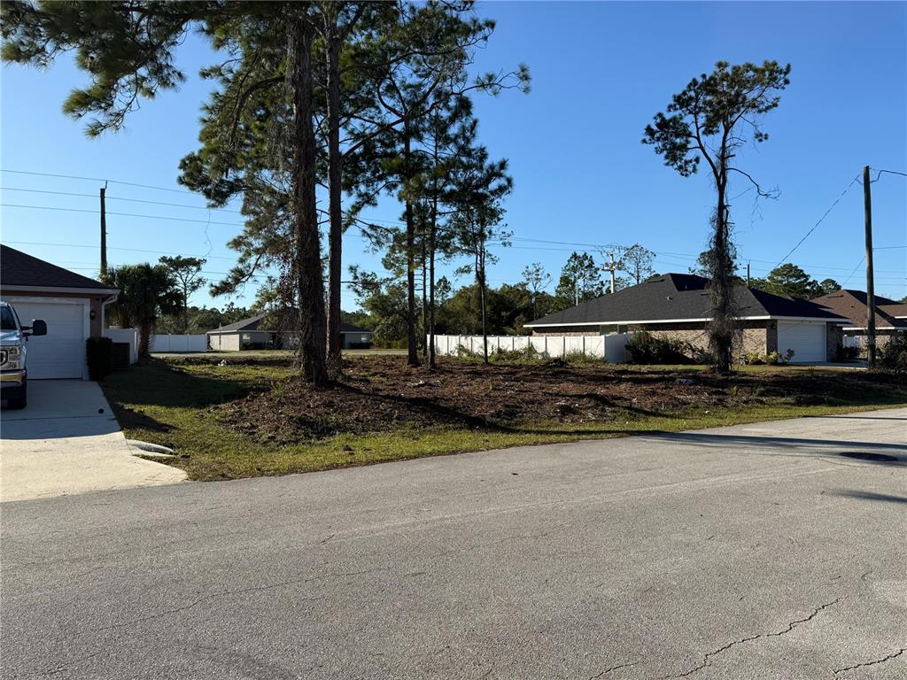 8 Sederholm Path Palm Coast, FL 32164 - Photo 5 of 5 a front view of a house with a yard and garage