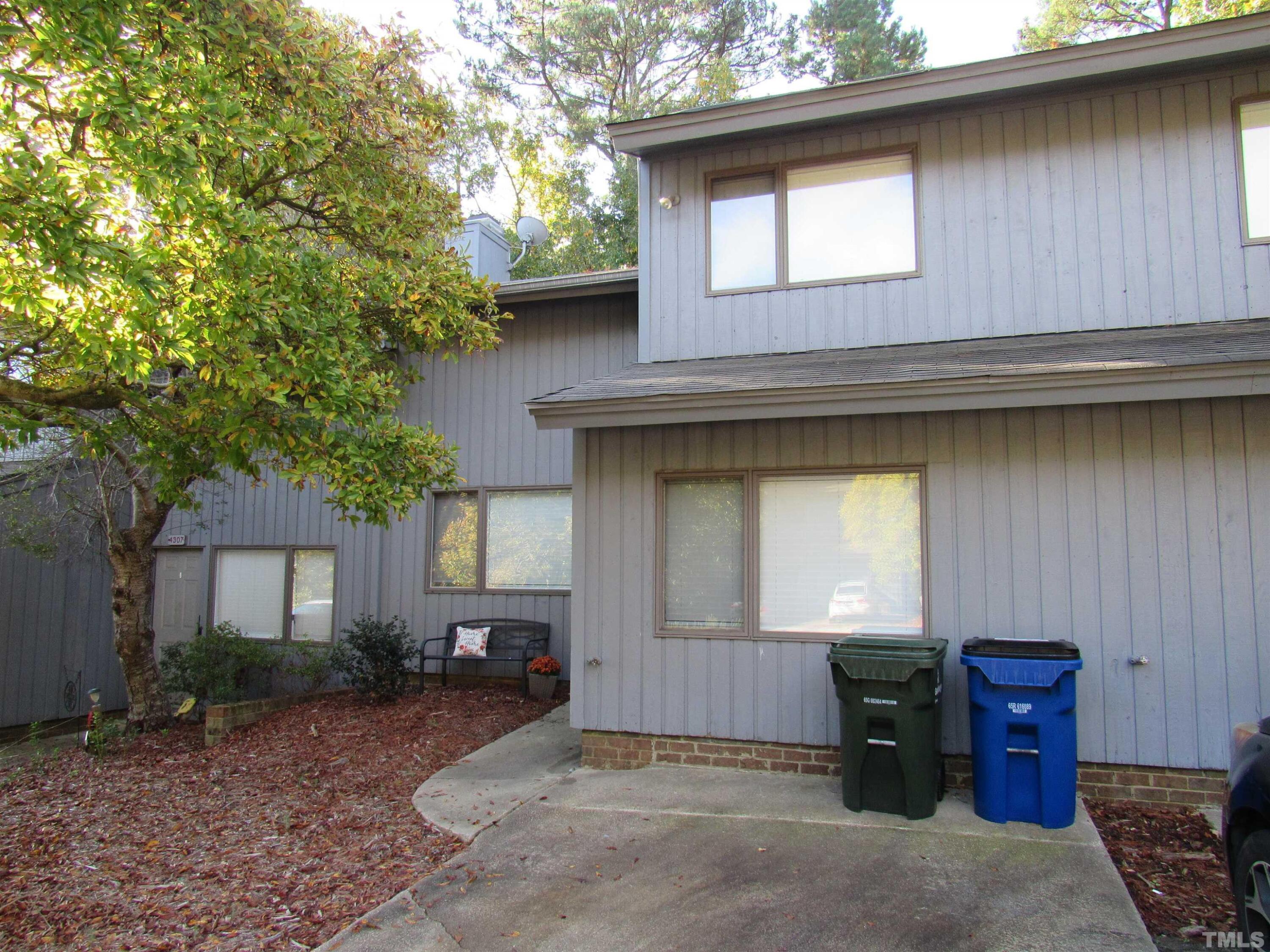 4309 Hunters Club Drive, Unit 4309 Raleigh, NC 27606 - Photo 1 of 35 a house view with a outdoor space