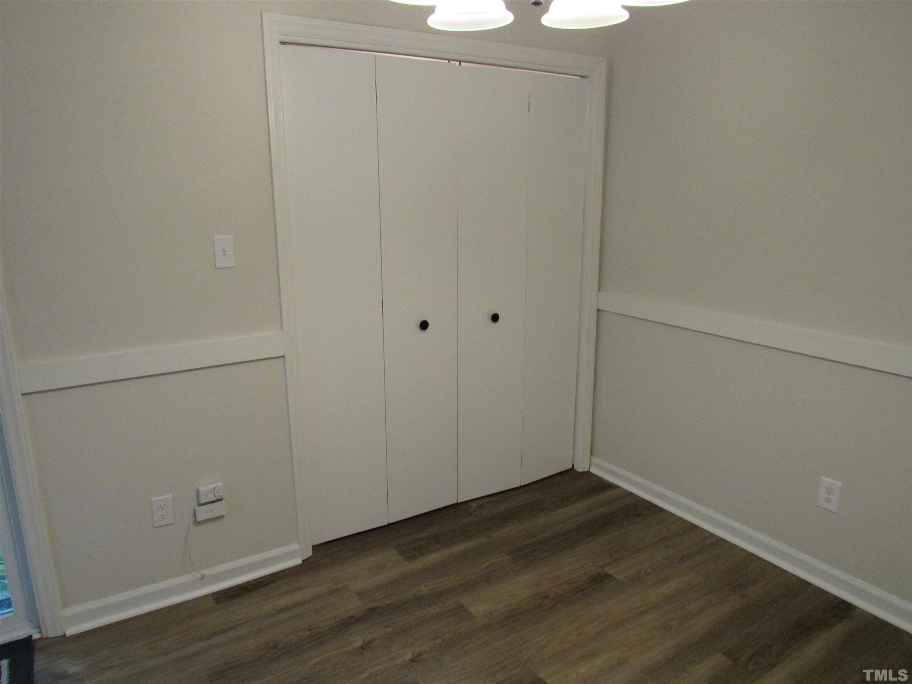 4309 Hunters Club Drive, Unit 4309 Raleigh, NC 27606 - Photo 20 of 35 an empty room with wooden floor