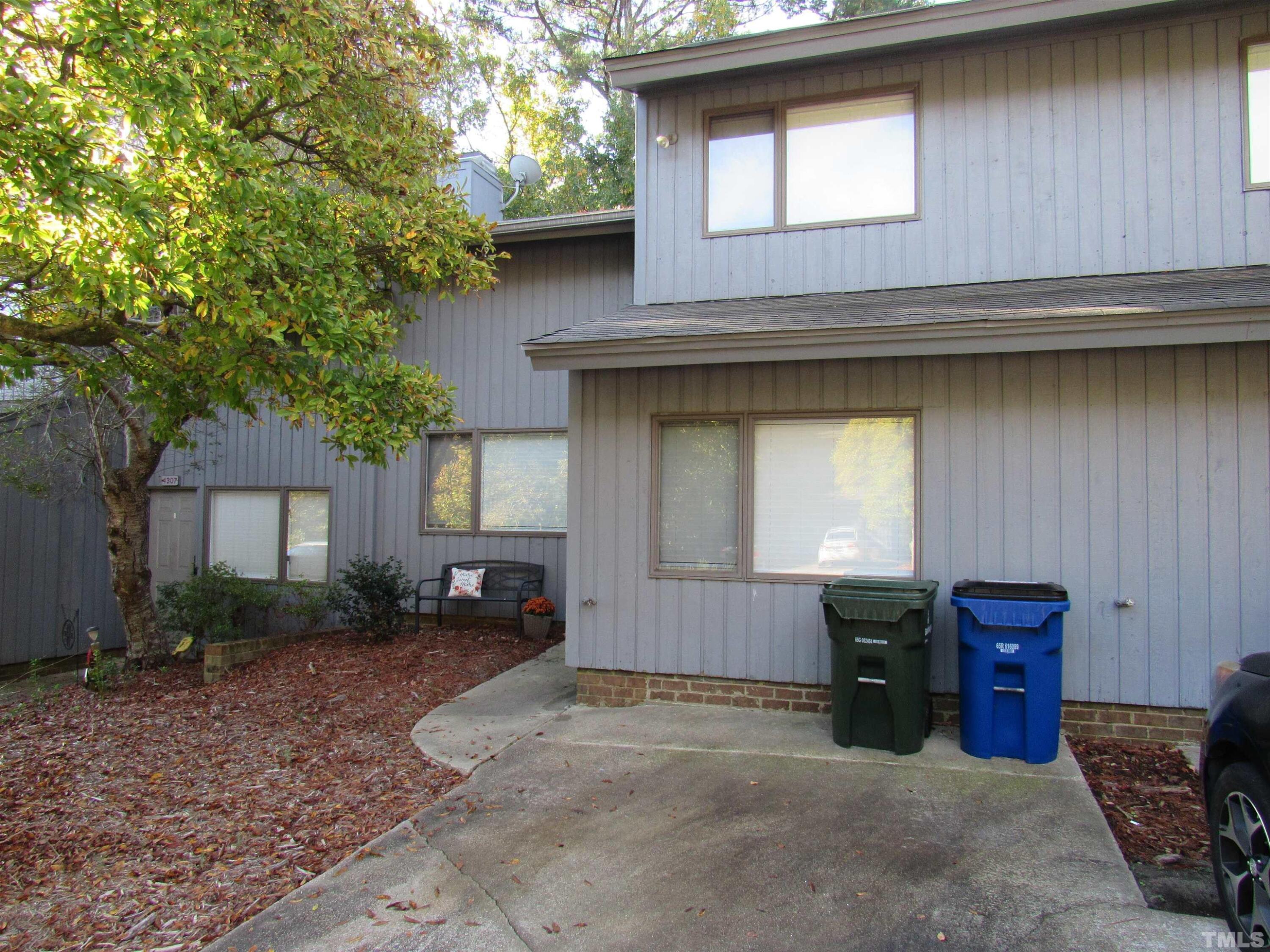 4309 Hunters Club Drive, Unit 4309 Raleigh, NC 27606 - Photo 2 of 35 a house view with a outdoor space