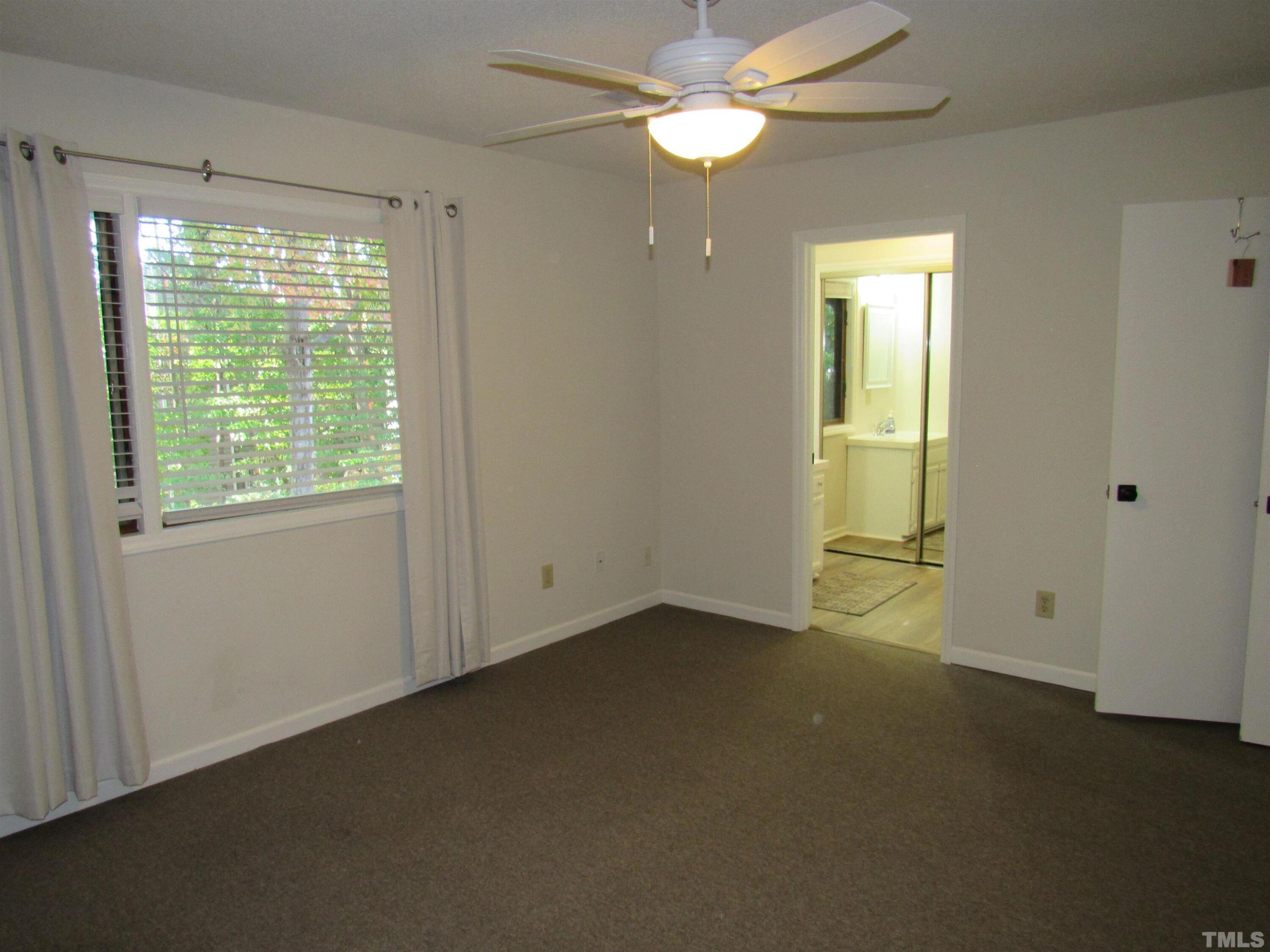 4309 Hunters Club Drive, Unit 4309 Raleigh, NC 27606 - Photo 29 of 35 a view of an empty room with a window