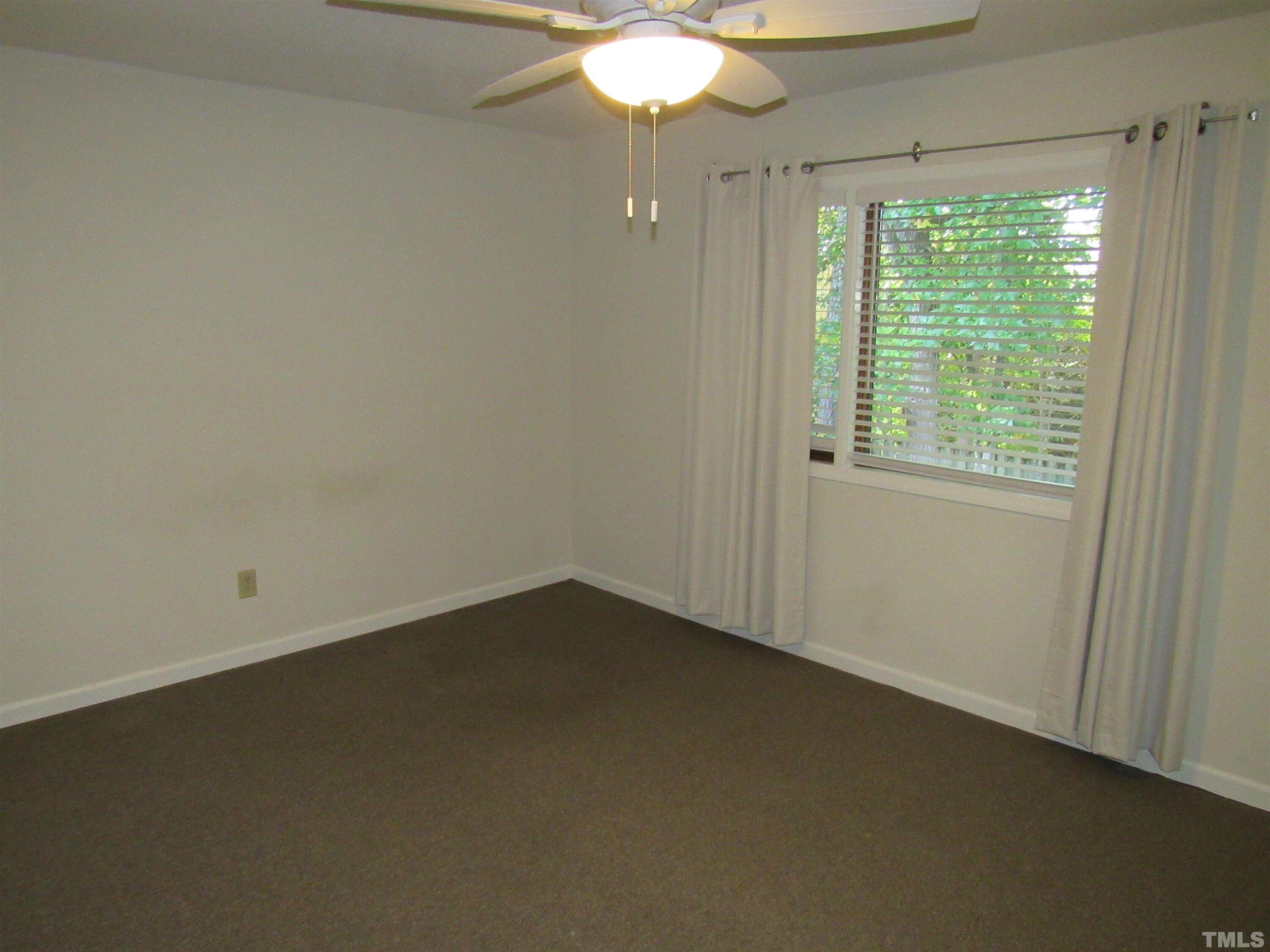 4309 Hunters Club Drive, Unit 4309 Raleigh, NC 27606 - Photo 30 of 35 an empty room with a window