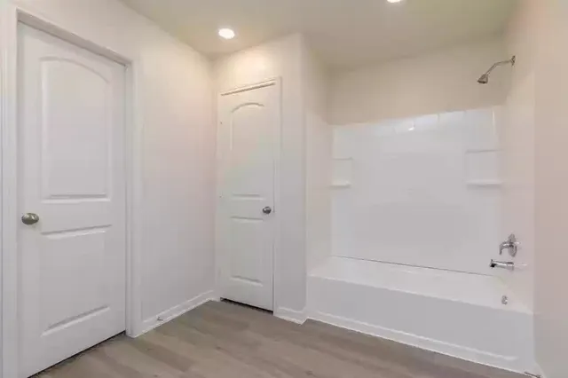 a view of bathroom with bathtub