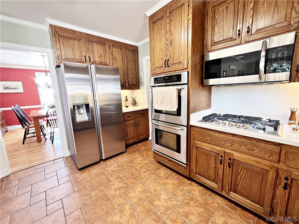 13330 West Salisbury Road Midlothian, VA 23113 - Photo 14 of 50 a kitchen with stainless steel appliances granite countertop a refrigerator and a stove top oven