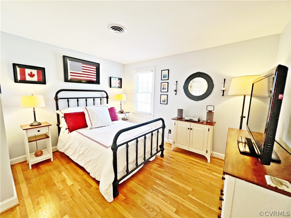 13330 West Salisbury Road Midlothian, VA 23113 - Photo 24 of 50 a bedroom with a bed and a flat screen tv