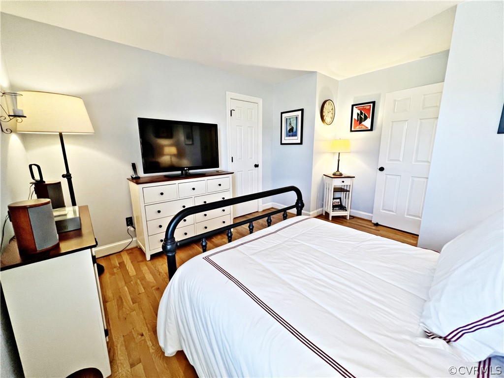 13330 West Salisbury Road Midlothian, VA 23113 - Photo 25 of 50 a bedroom with a bed and a flat screen tv