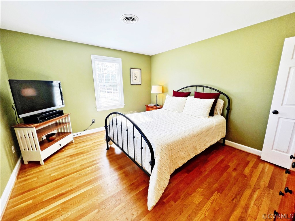 13330 West Salisbury Road Midlothian, VA 23113 - Photo 27 of 50 a bedroom with a bed and a flat screen tv