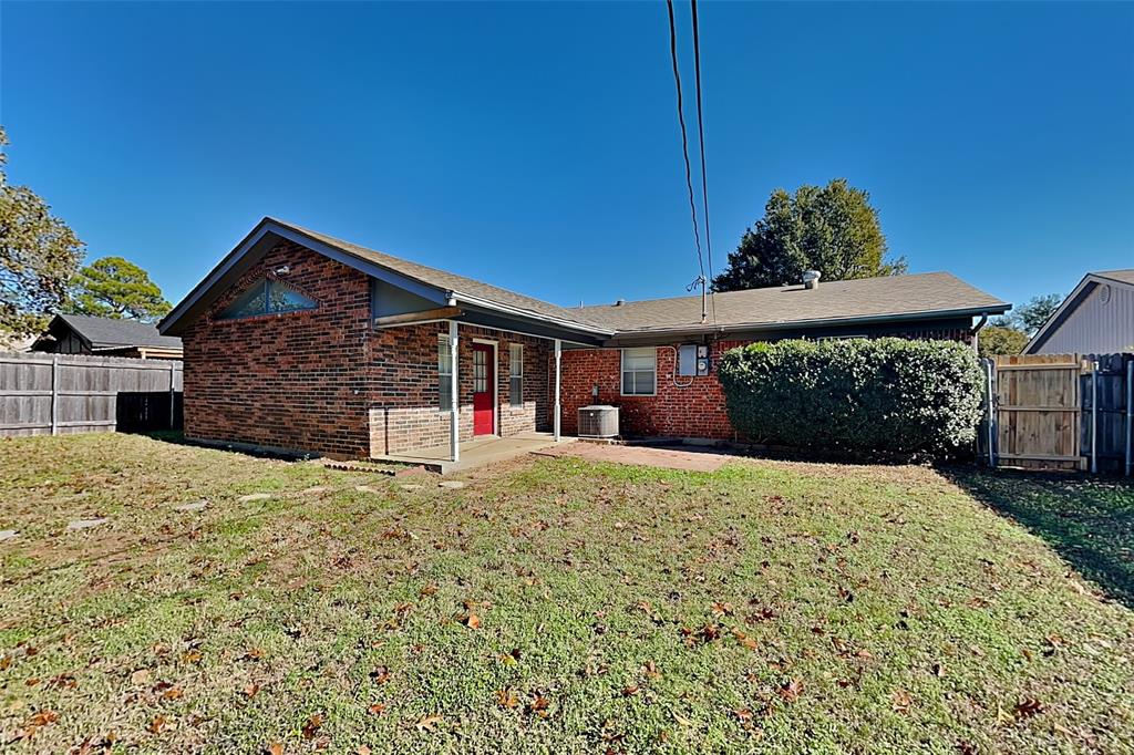 433 Arwine Drive Hurst, TX 76053 - Photo 17 of 18 a front view of a house with a yard and garage