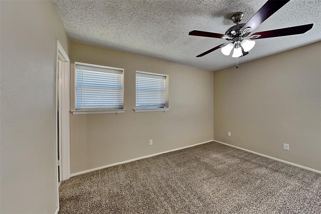 433 Arwine Drive Hurst, TX 76053 - Photo 7 of 18 a view of an empty room with a window