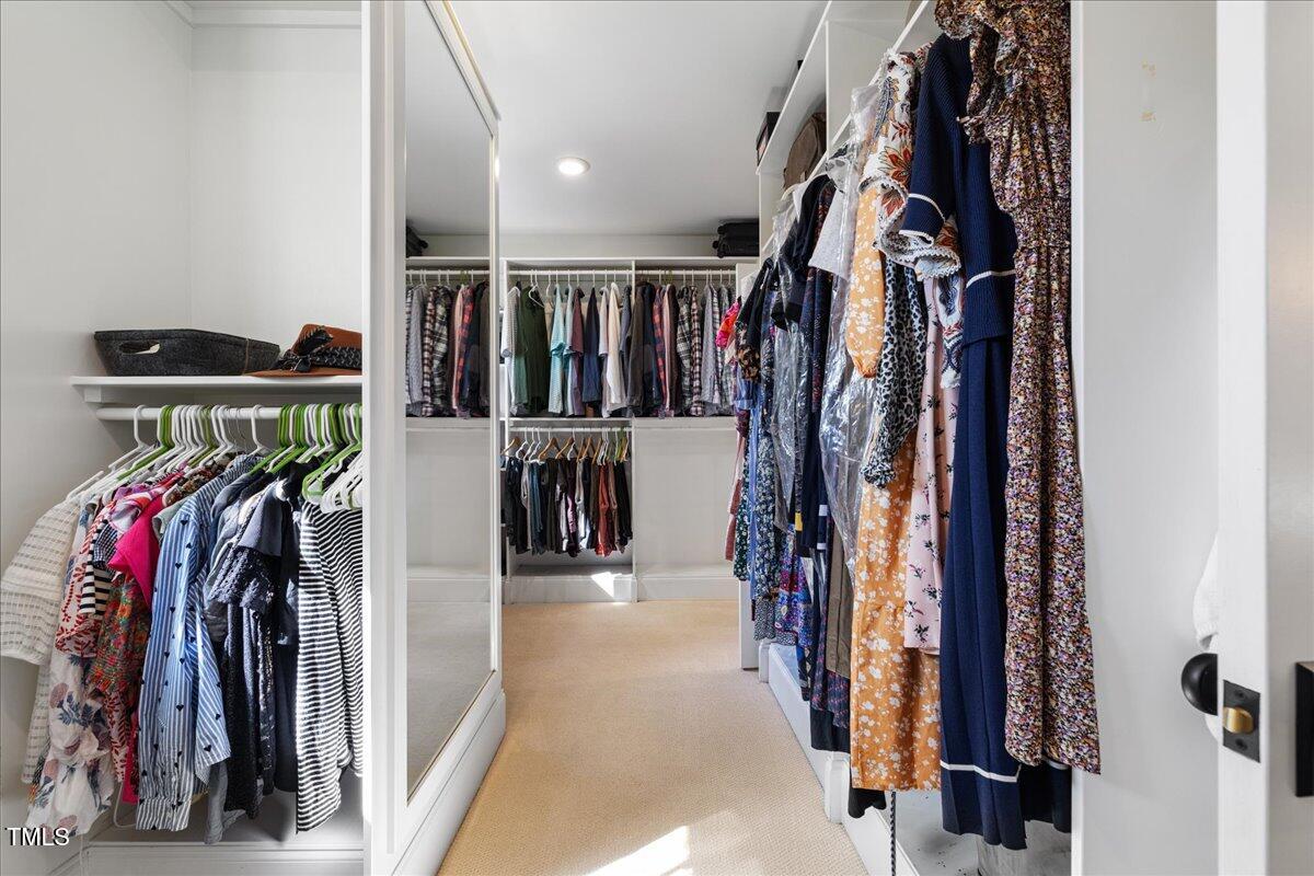 3513 Bellevue Road Raleigh, NC 27609 - Photo 35 of 61 a view of walk in closet with clothes