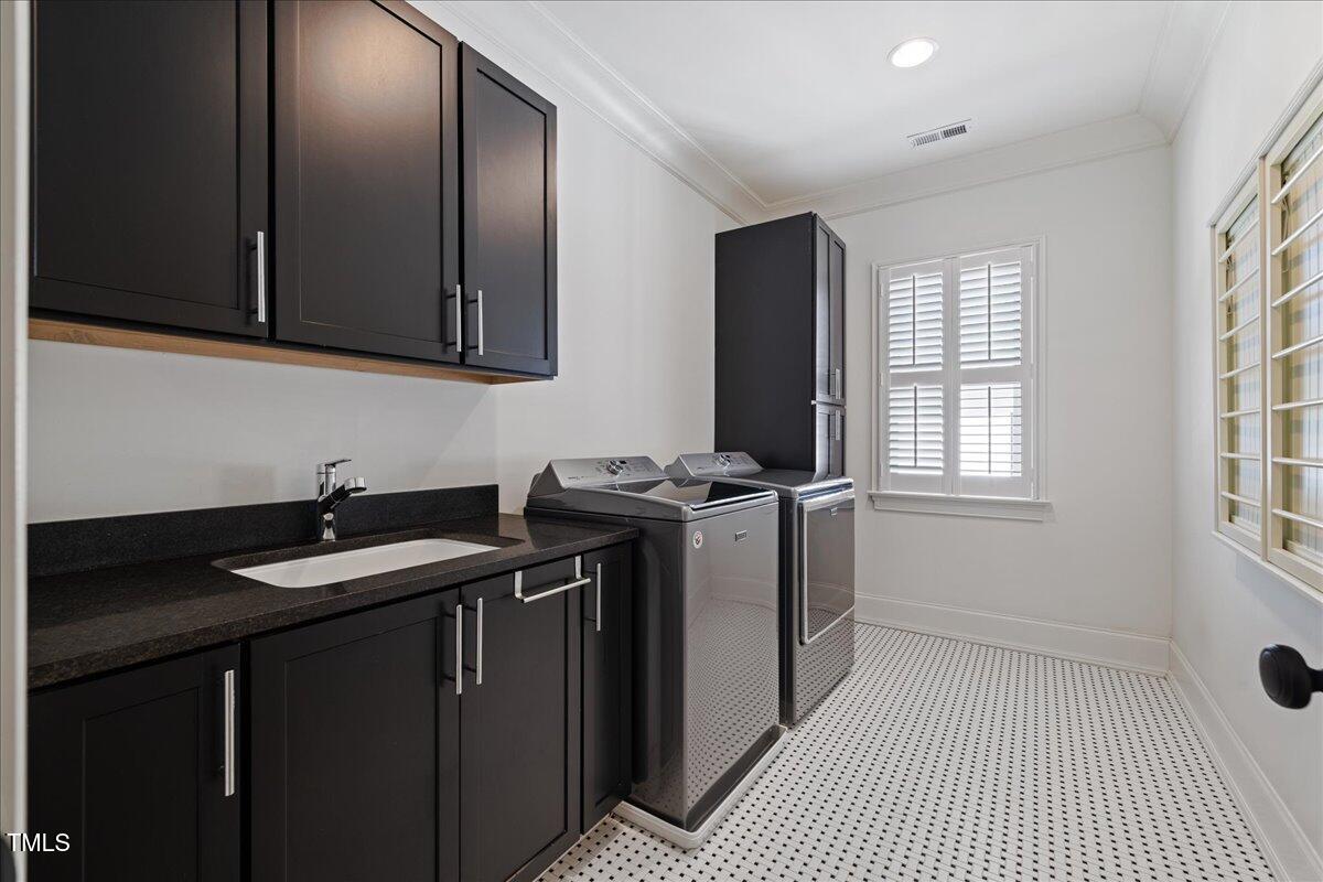 3513 Bellevue Road Raleigh, NC 27609 - Photo 42 of 61 a utility room with sink dryer and washer