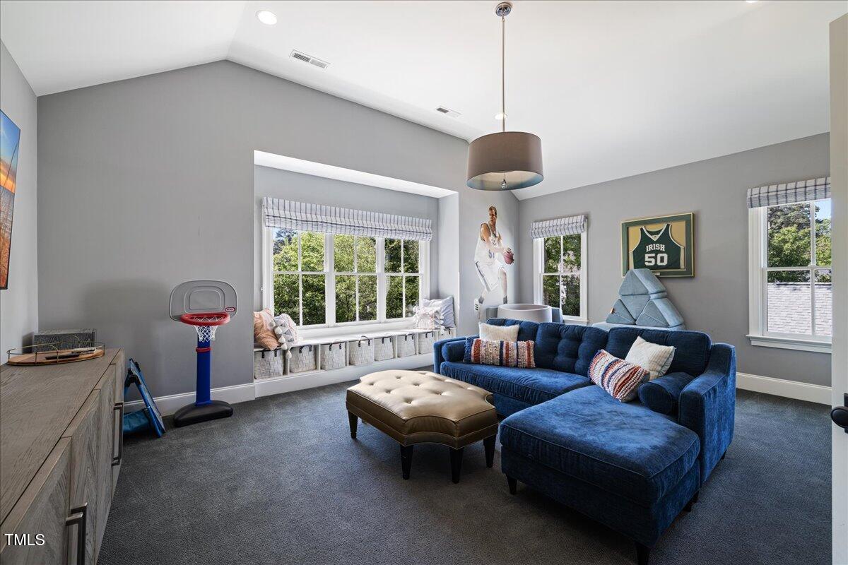 3513 Bellevue Road Raleigh, NC 27609 - Photo 46 of 61 a living room with furniture and a large window