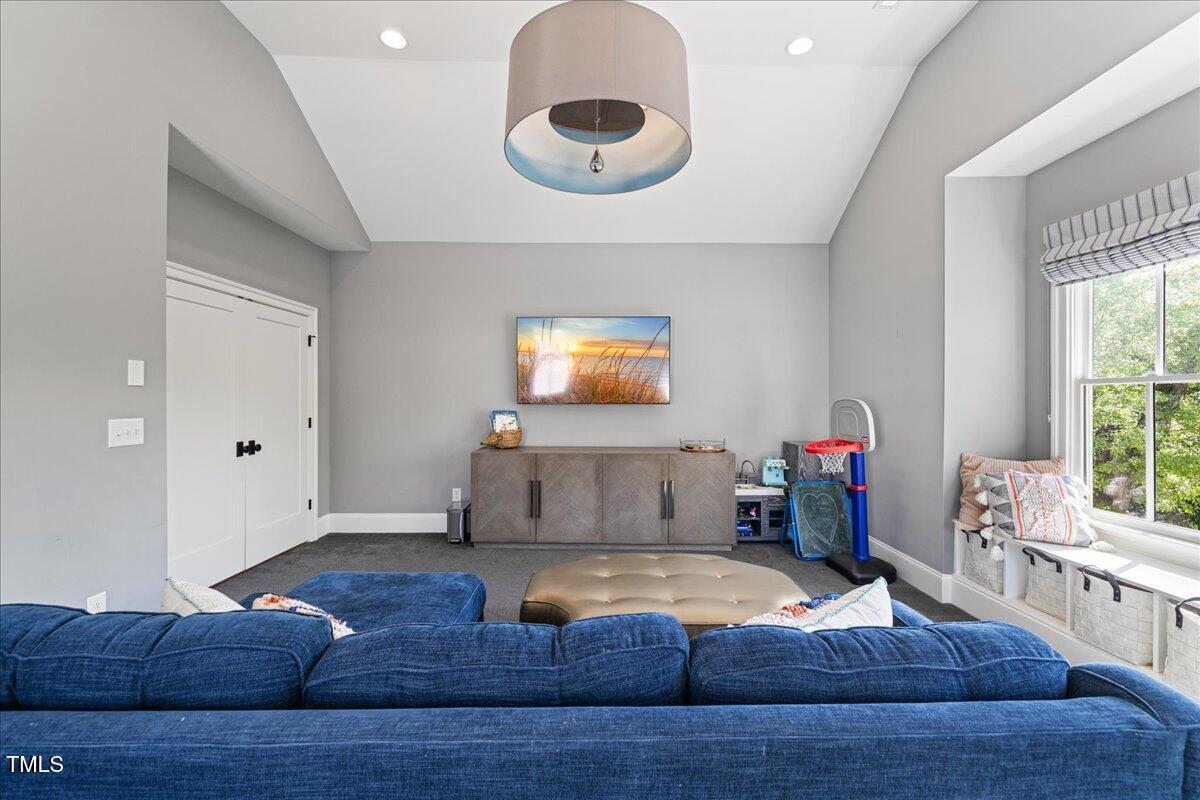 3513 Bellevue Road Raleigh, NC 27609 - Photo 47 of 61 a living room with furniture and a large window