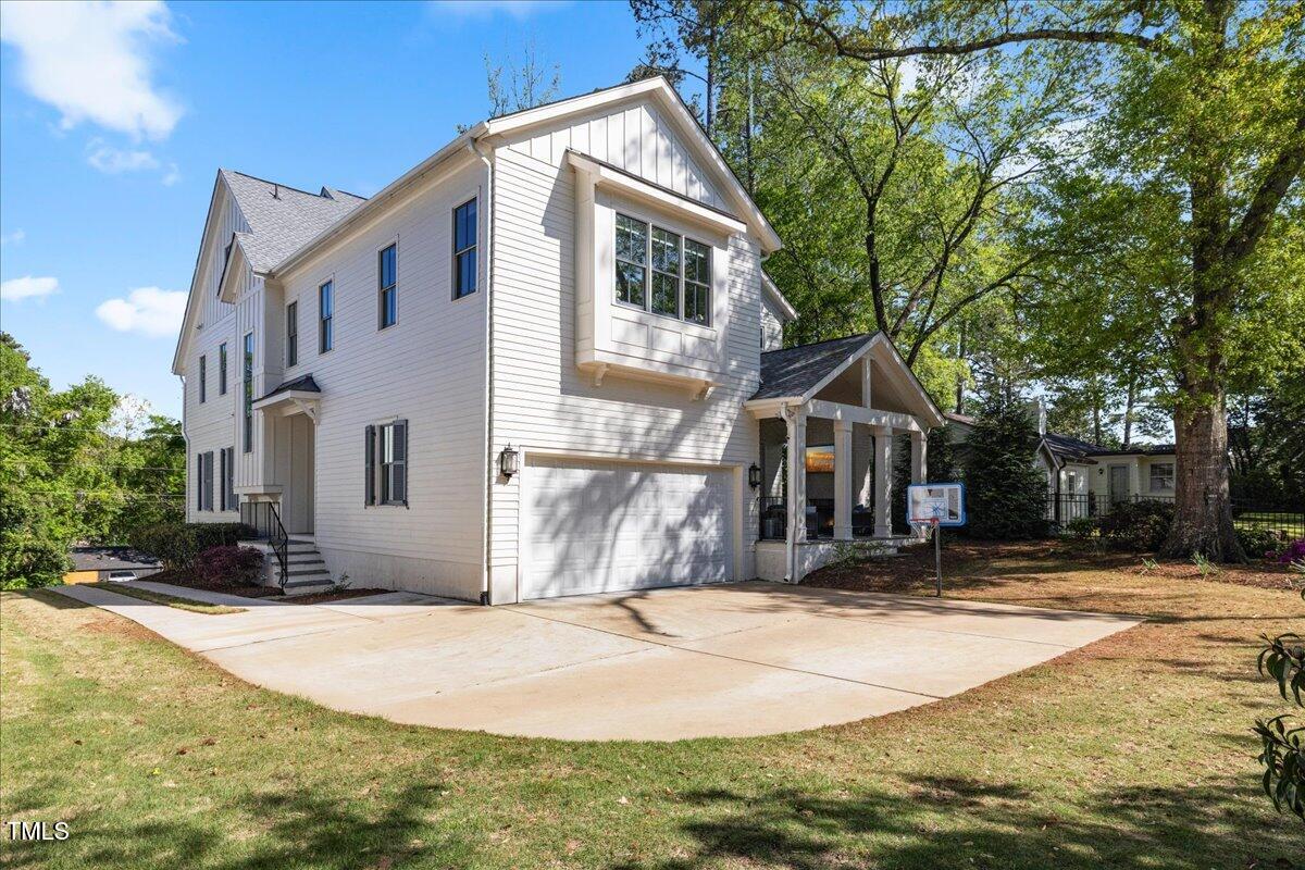 3513 Bellevue Road Raleigh, NC 27609 - Photo 53 of 61 a view of a house with snow on the road