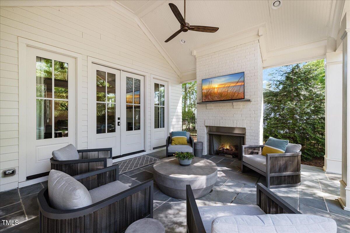 3513 Bellevue Road Raleigh, NC 27609 - Photo 56 of 61 a living room with furniture and a fireplace