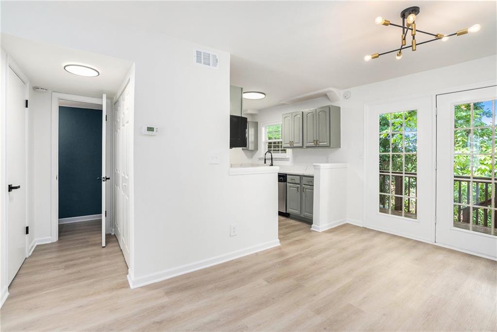 a view of a kitchen with a sink and a window