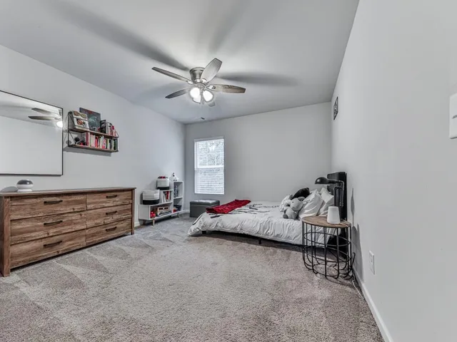 a bed room with furniture and a window