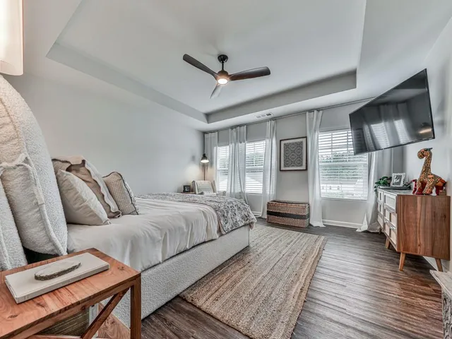 a bedroom with furniture and a window