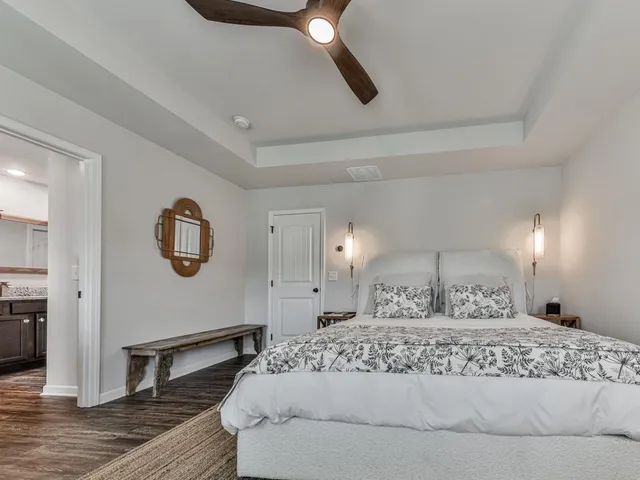 a large white bed in a white room