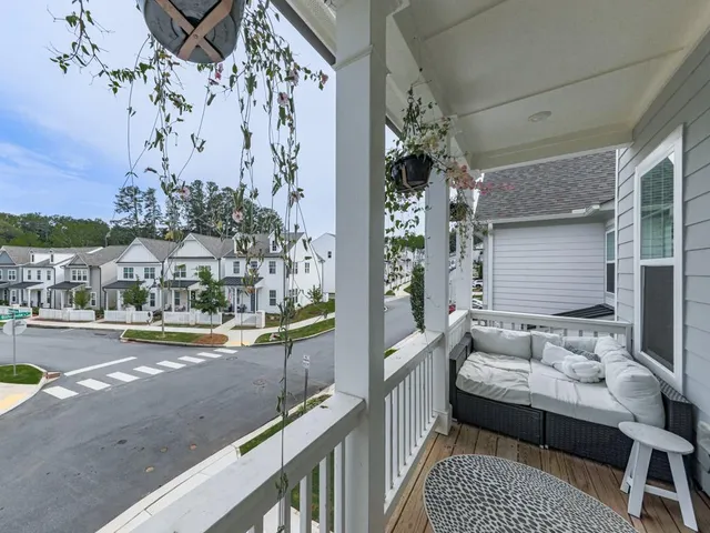 a view of balcony with furniture